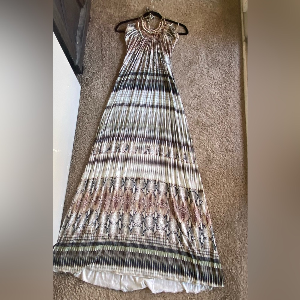 Snake skin print with shell and beaded neck detail.